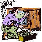 Technician servicing the back of a wood console television cabinet